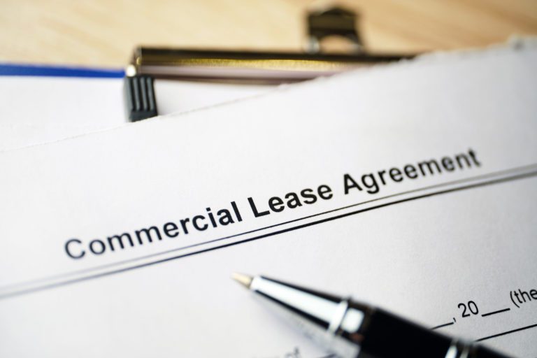 Legal document Commercial Lease Agreement on paper.
