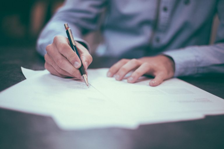 Building Owner Signing Commercial Property Insurance Policy